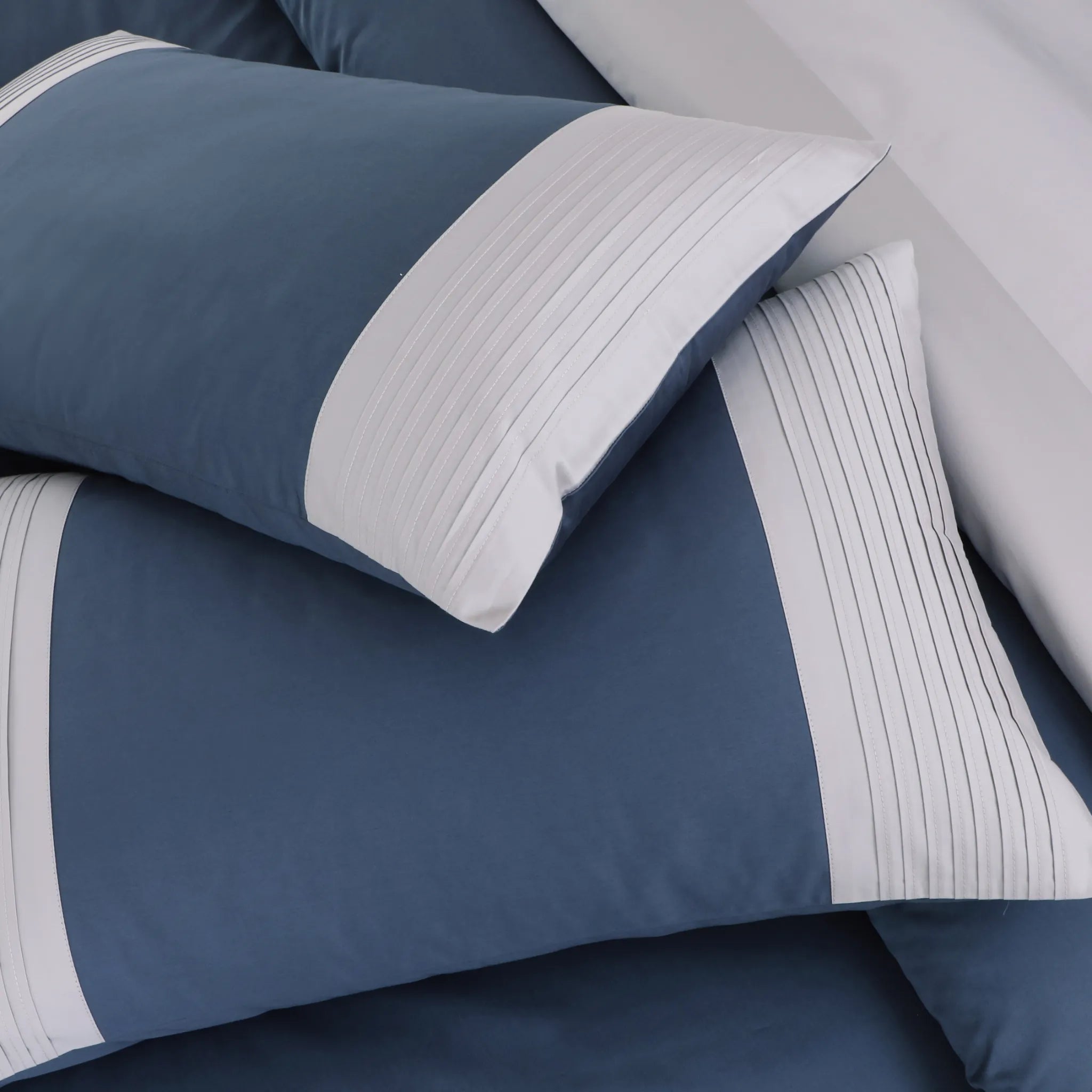 Blue and gray bedding set with striped edges